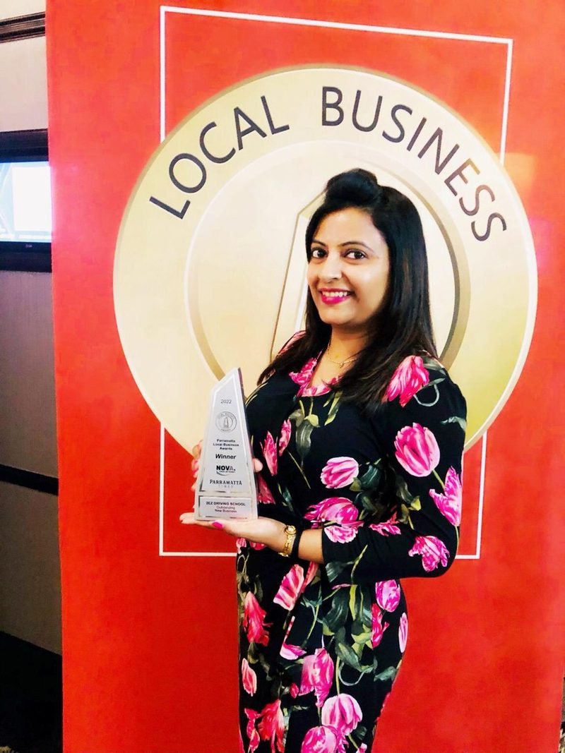 Bhumi with the 2022 Parramatta Local Business Award trophy