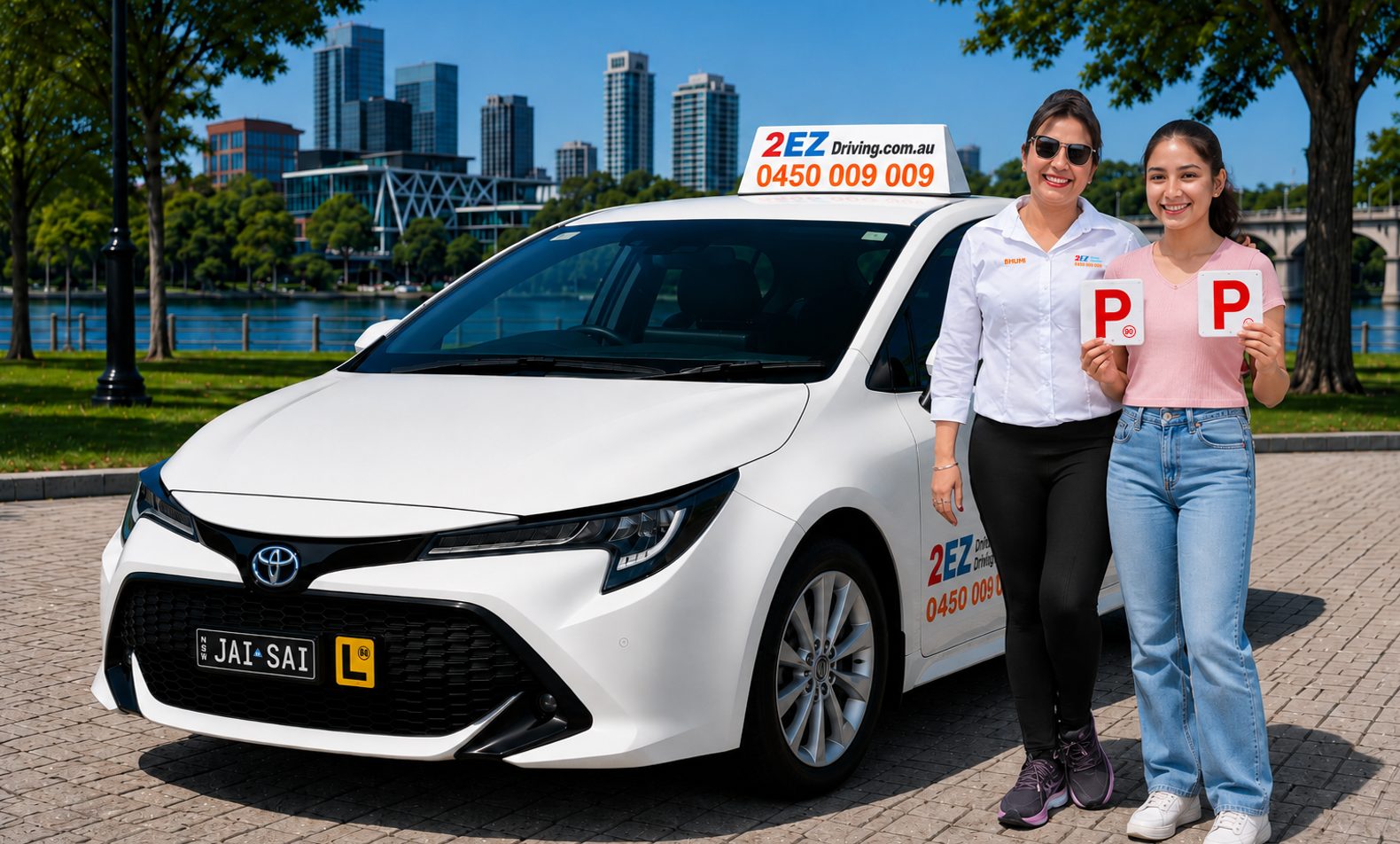 Bhumi beside the 2EZ dual-control Toyota Corolla with a learner holding her new P plates